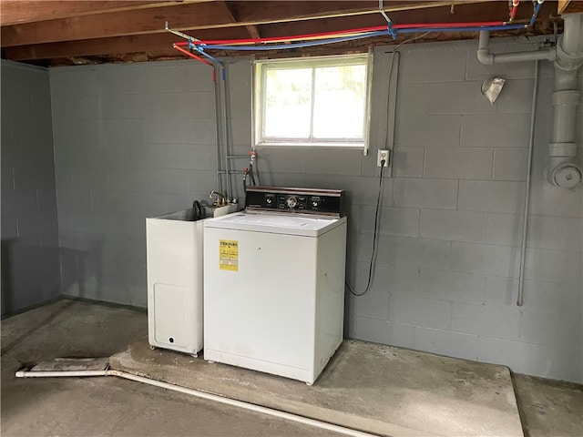 clothes washing area with washer / dryer