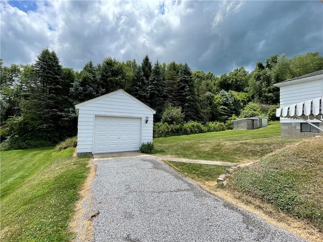 garage featuring a yard