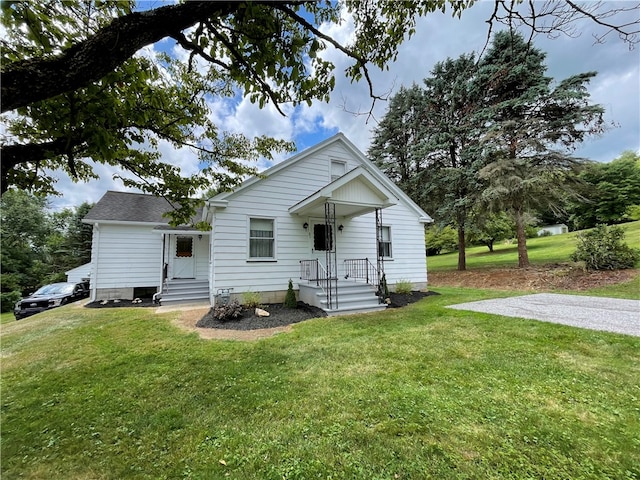 bungalow-style house with a front yard