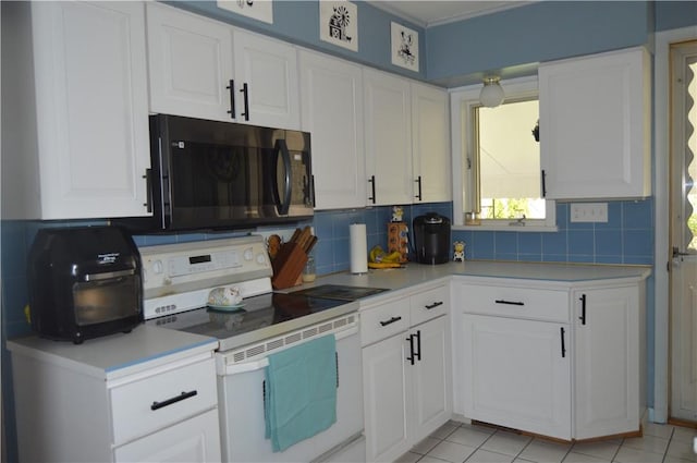 kitchen featuring white cabinets, light tile patterned floors, electric range, and backsplash