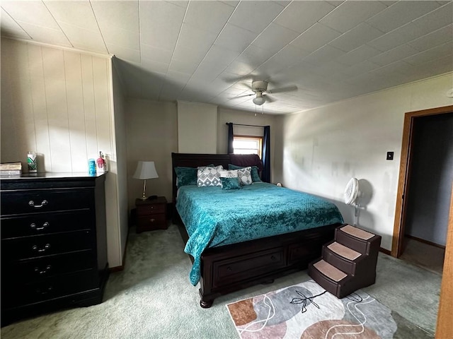 bedroom with ceiling fan and light colored carpet