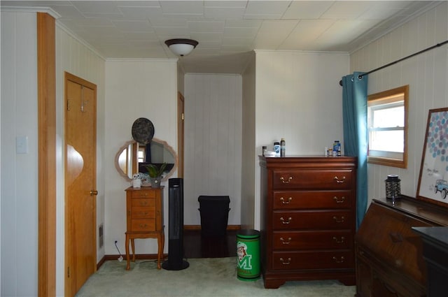 bedroom with carpet flooring and crown molding