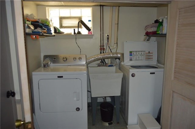 laundry area featuring separate washer and dryer and sink