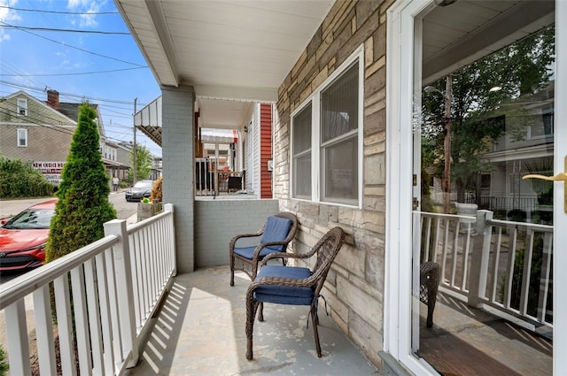 balcony featuring a porch