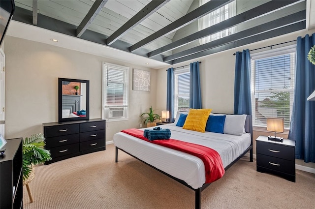 bedroom featuring lofted ceiling with beams, baseboards, and light carpet