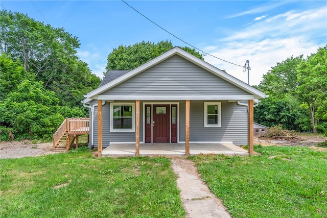 bungalow featuring a porch and a front yard