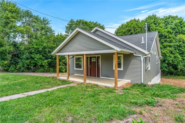 58 Wansack Rd, Shenango Twp Mer, PA 16159 - bungalow-style house featuring roof with shingles, a front lawn, and a porch