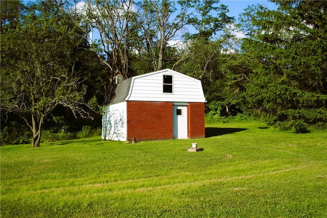 view of outdoor structure with a lawn