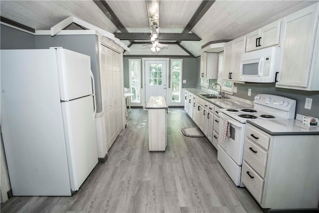 kitchen with white appliances, white cabinets, sink, light hardwood / wood-style floors, and ceiling fan