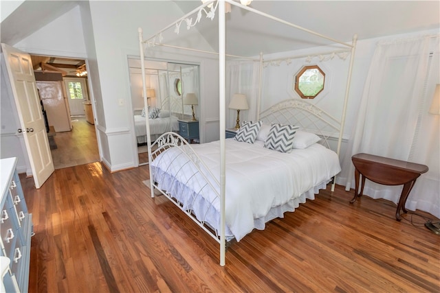 bedroom with a closet and hardwood / wood-style floors