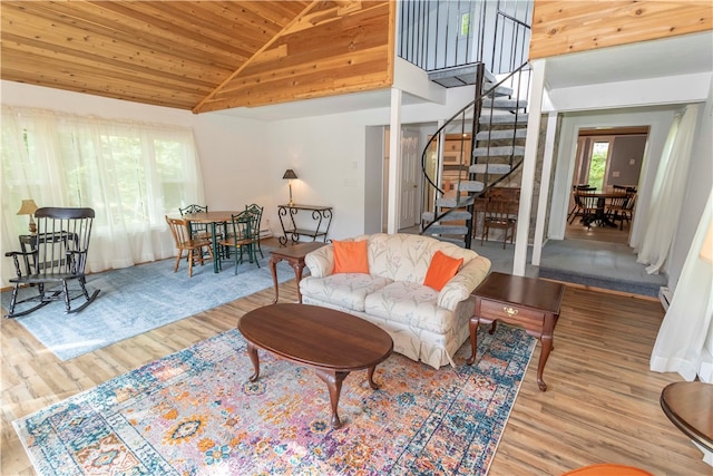 living room with wood ceiling, high vaulted ceiling, and hardwood / wood-style floors