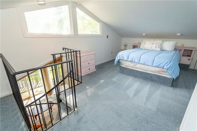 carpeted bedroom featuring lofted ceiling