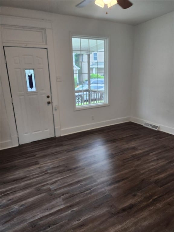 foyer with dark wood-type flooring and ceiling fan