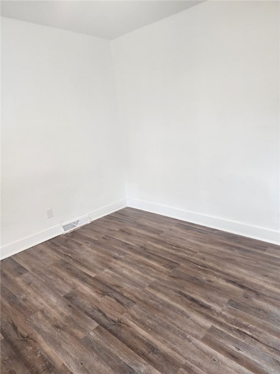 empty room featuring dark hardwood / wood-style floors