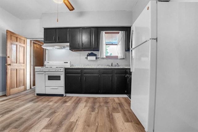 kitchen featuring sink, white appliances, ceiling fan, and light wood-type flooring