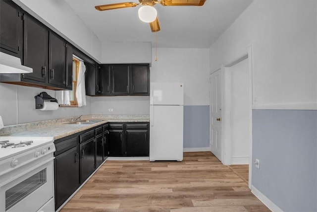 kitchen with ceiling fan, sink, white appliances, and light hardwood / wood-style flooring