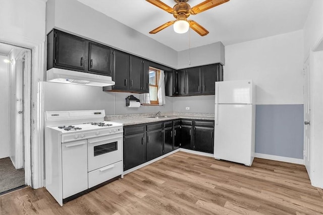 kitchen with ceiling fan, white appliances, sink, and light hardwood / wood-style flooring