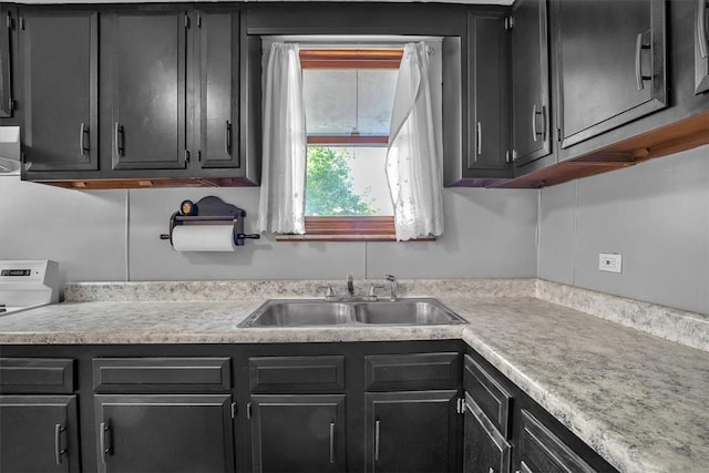 kitchen featuring range and sink