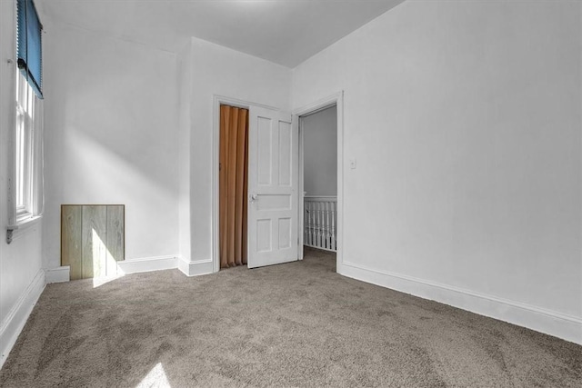 unfurnished room with carpet