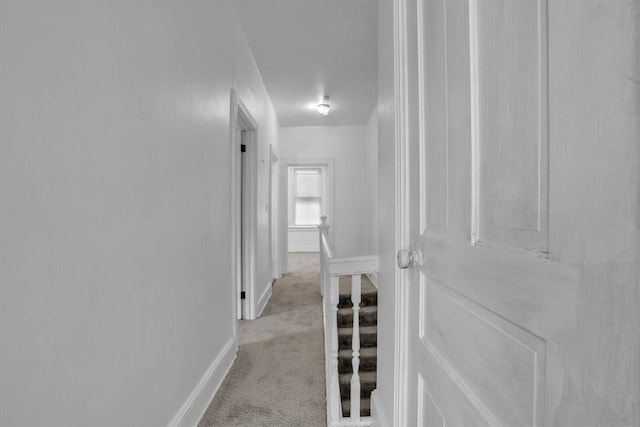 corridor with light colored carpet