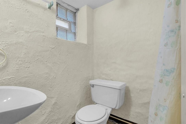 bathroom with toilet and sink