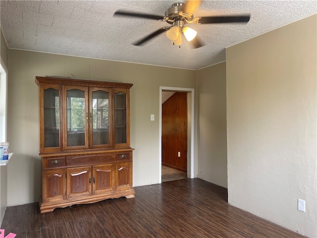 empty room with wood-type flooring and ceiling fan