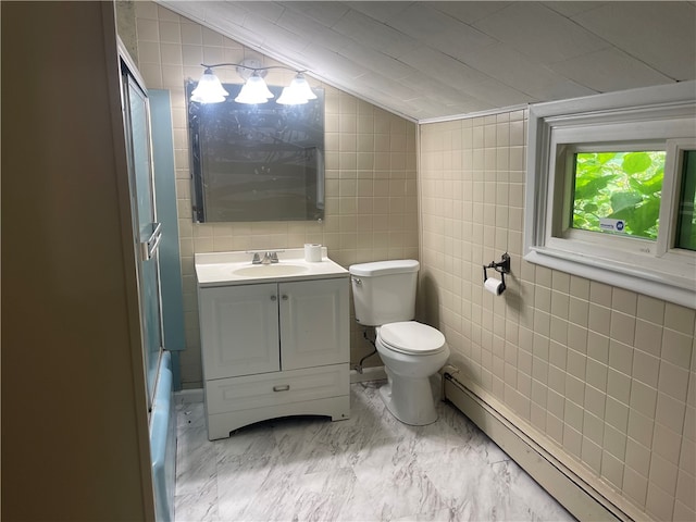 full bathroom with lofted ceiling, toilet, vanity, tile walls, and a baseboard radiator