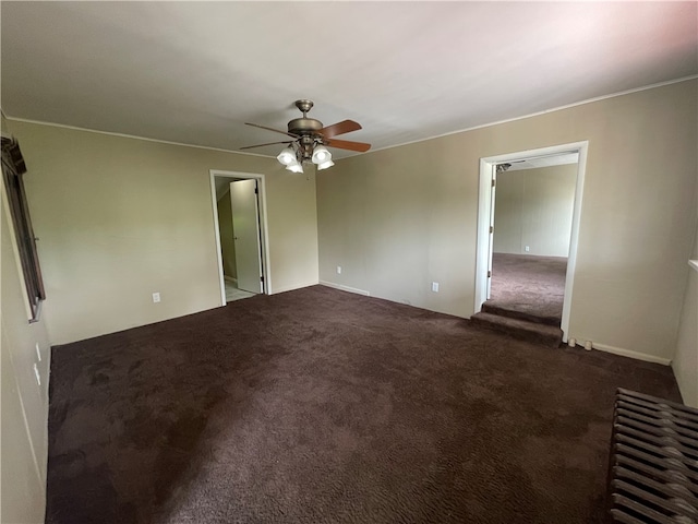 carpeted empty room featuring ceiling fan