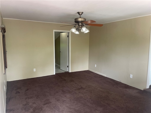 carpeted empty room featuring crown molding and ceiling fan