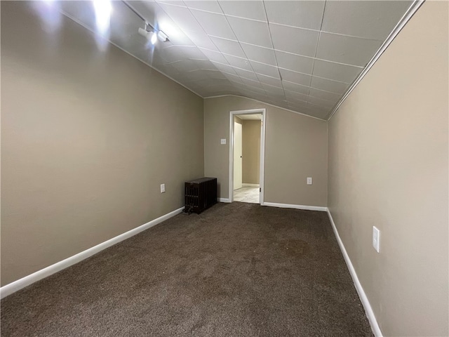 bonus room with carpet floors and lofted ceiling