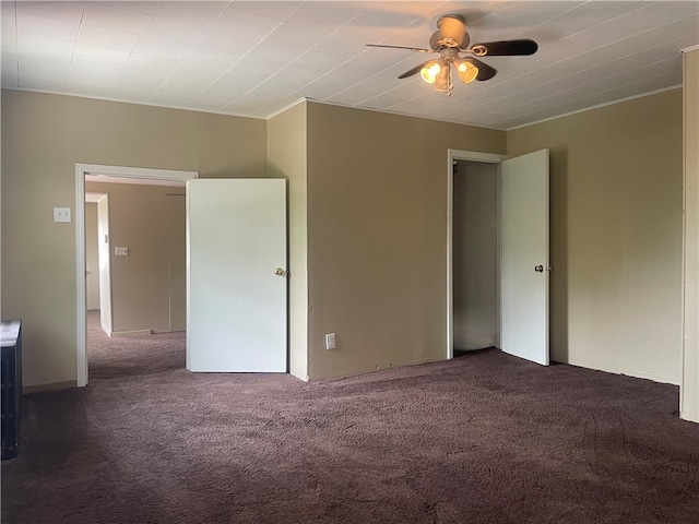 unfurnished room featuring carpet and ceiling fan