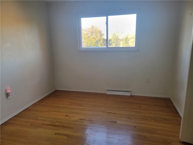 spare room with light hardwood / wood-style floors