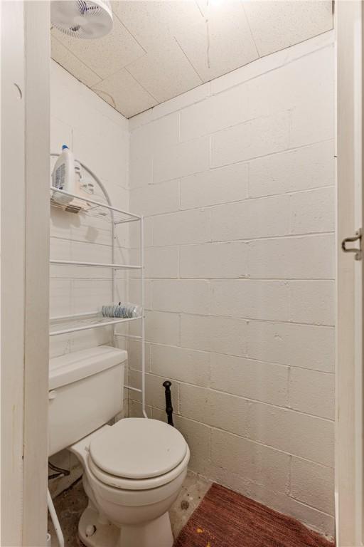 1120 Henderson Ave, Canton Twp, PA 15301 - bathroom with concrete block wall and toilet