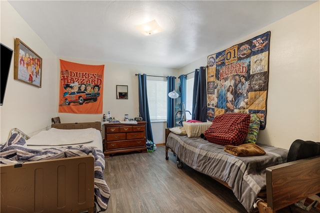 bedroom with hardwood / wood-style flooring