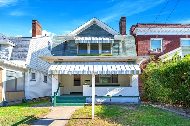 back of house with a yard