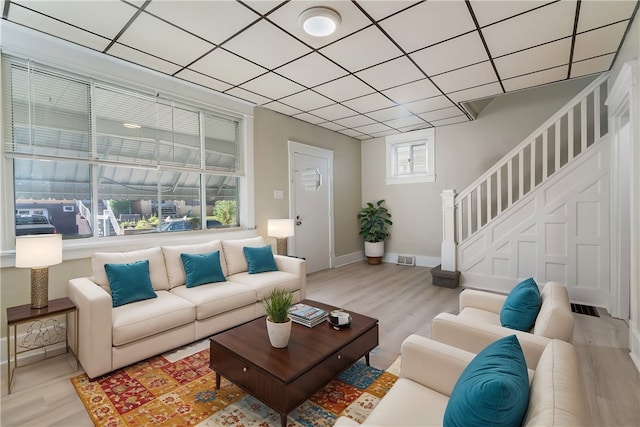 living room with light hardwood / wood-style flooring and a wealth of natural light