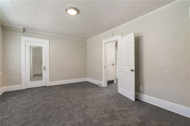 carpeted spare room with crown molding