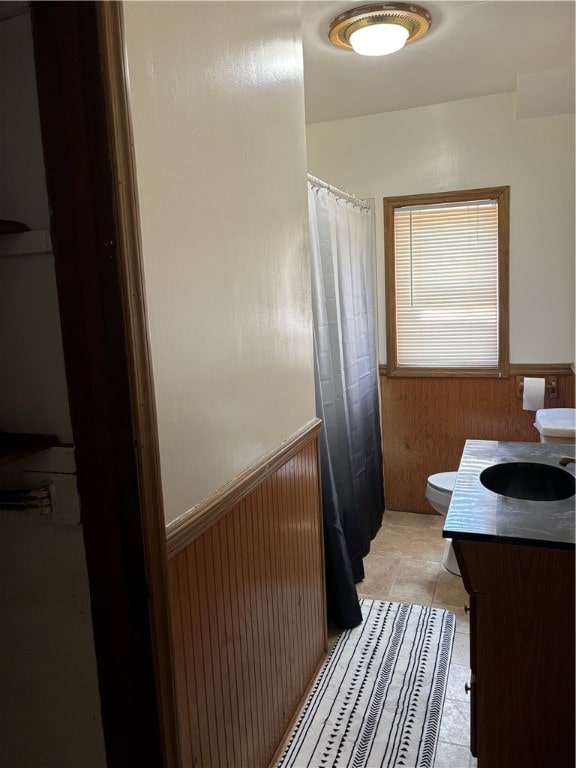 bathroom featuring vanity, toilet, and tile patterned floors