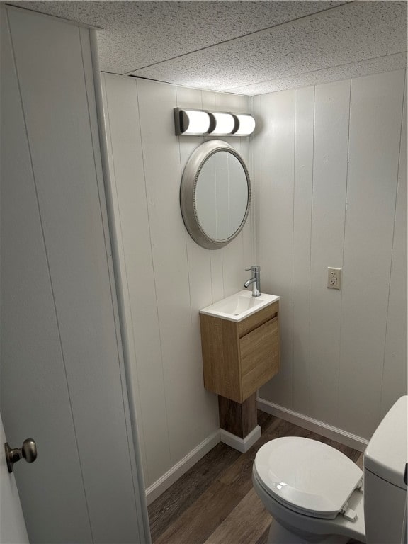 bathroom featuring toilet and hardwood / wood-style flooring