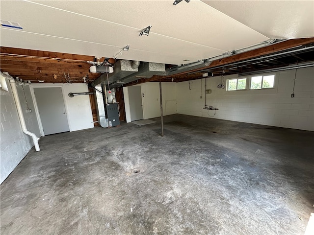 garage with a garage door opener and heating unit