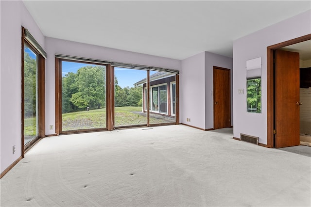 empty room featuring light colored carpet