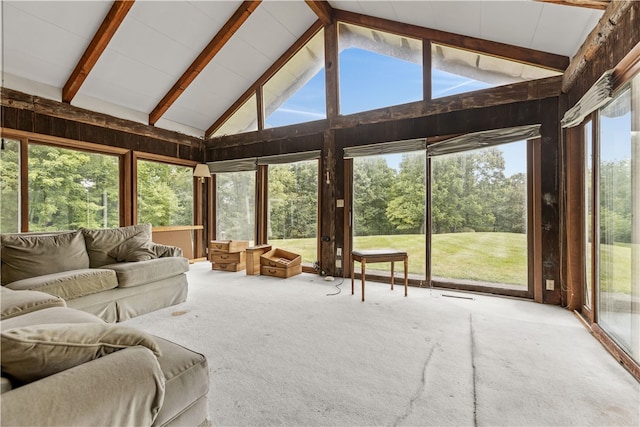 sunroom with lofted ceiling with beams