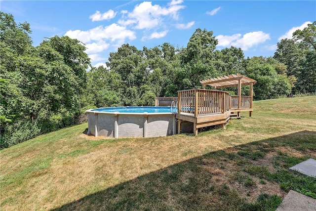 exterior space featuring a pergola, a lawn, and a deck