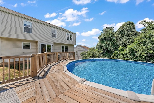 view of swimming pool featuring a deck