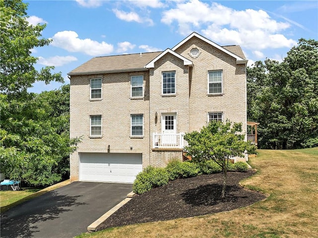 view of home's exterior featuring a garage and a yard