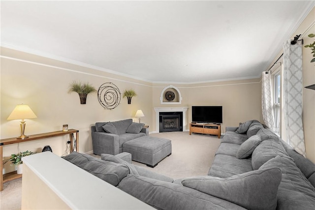 carpeted living room with ornamental molding