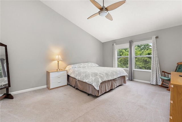 bedroom with lofted ceiling, light carpet, and ceiling fan