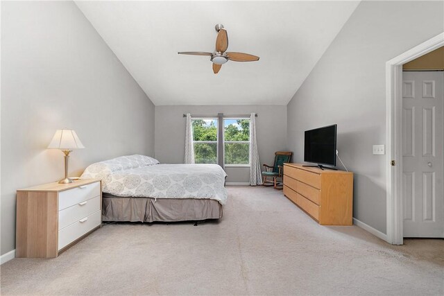 carpeted bedroom with lofted ceiling and ceiling fan