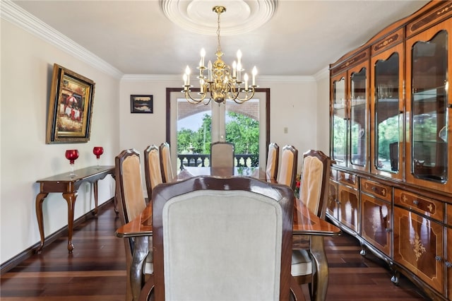 dining room with an inviting chandelier, crown molding, and dark hardwood / wood-style floors