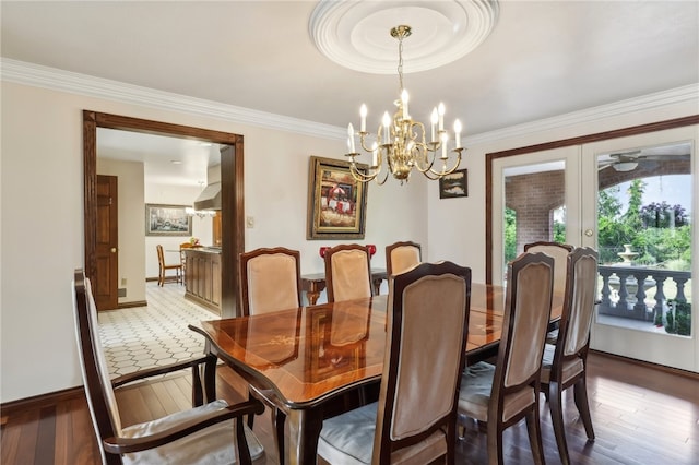 tiled dining room featuring a chandelier and french doors